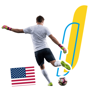 Un alumno jugando futbol, de espaldas chutando un balón en el programa de InterWay en Boston College, con la bandera estadounidense